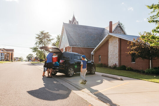 Unloading the car for a sports game. 