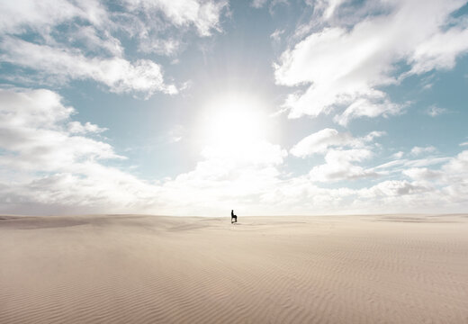 Man sitting on a chair at the desert