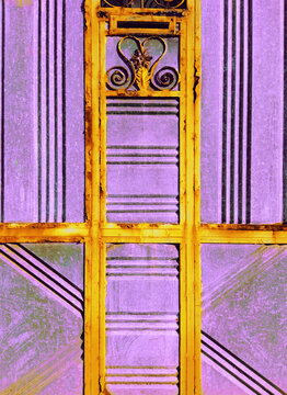Old, purple vintage metal doors with rusty yellow decorative elements