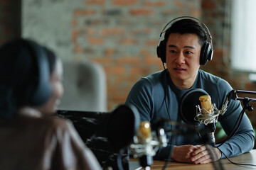 Speaker listening person during recording podcast