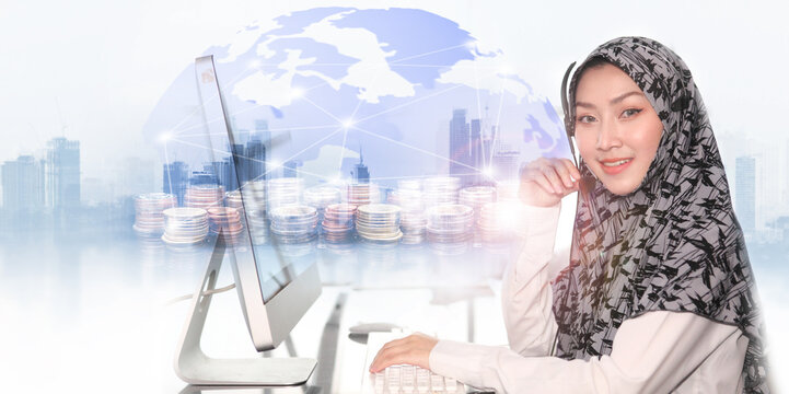  International financial consulting and rows of coins for finance and banking concept with Asian Muslim female  with headsets working in a call center. Call center agent working for support