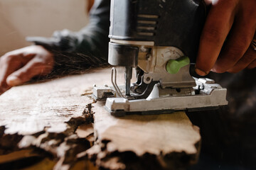 Close up of a jigsaw cutting wood