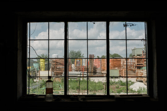 Window view to an industrial yard