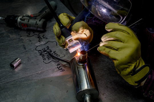 Man welding in his workshop