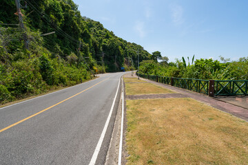 The asphalt road around the phuket island in Summer season beautiful blue sky background at Phuket Thailand.