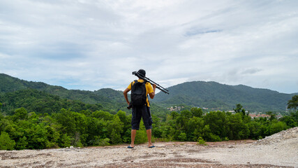 Professional man Photography on high mountain take a picture Landscape nature view at Phuket Thailand