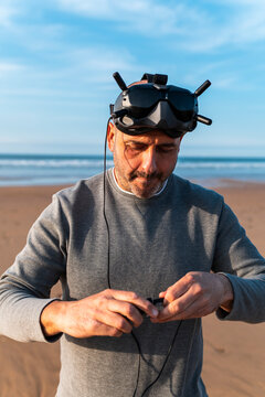 Man preparing VR glasses for drone FPV flight 