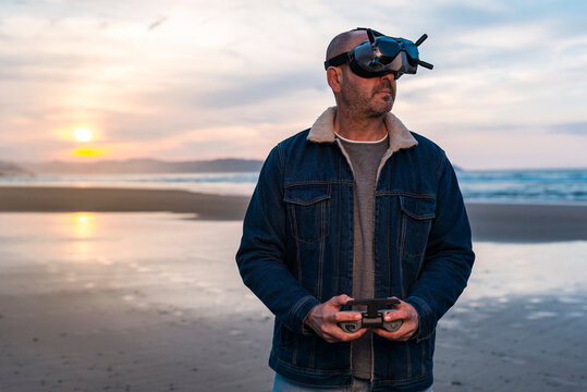 Adult male controlling drone in glasses of virtual reality