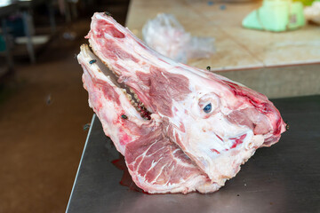 Fresh pork head , Animal heads,  Raw fresh head of pig for sale at asian food market
