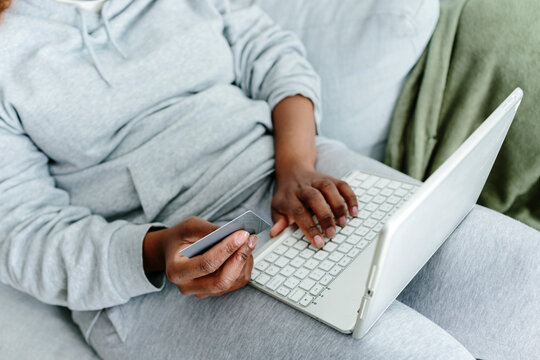Woman's hands at home buying online 
