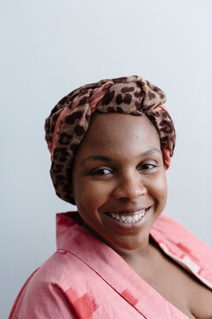 Portrait of woman with head wrap smiling