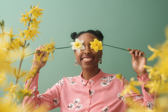 Black Woman Holding Daffodil Flowers