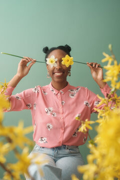 Springtime Portrait Of Woman Holding Flowers