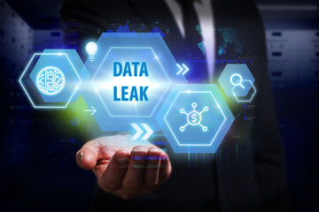 Business, Technology, Internet and network concept. Young businessman working on a virtual screen of the future and sees the inscription: Data leak