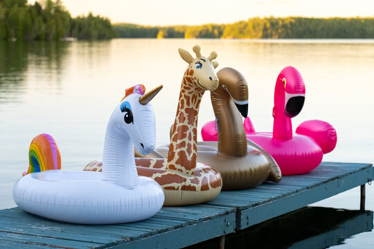 Inflatable Pool Toys at Summer Cottage Lake Dock at Sunset