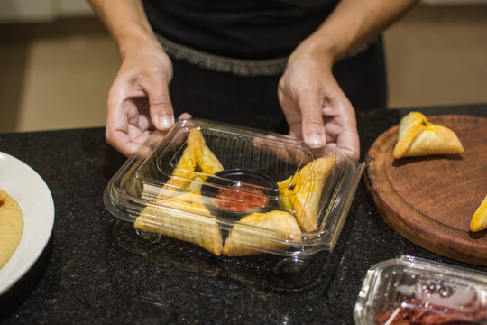 Woman packaging lunch