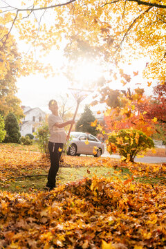 boy raking leaves 