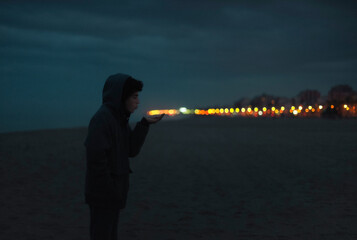 Teenage blowing traffic lights