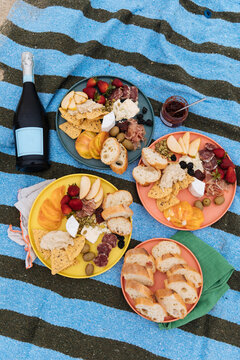Fancy cheese and fruit picnic with prosecco