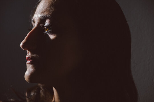 A side portrait of a girl in contrast light.