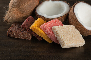 Cocada coconut candy, sweet Brazilian in rustic wood background