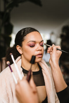Woman getting her makeup done