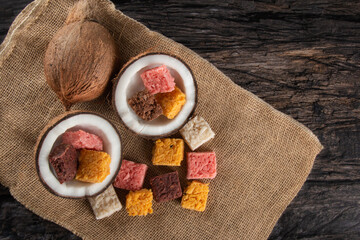 Cocada coconut candy, sweet Brazilian in rustic wood background