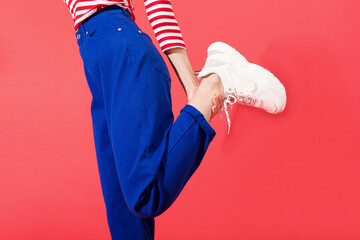 Stylish woman in casual outfit and sneakers