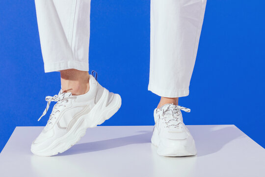 White sneakers on blue background