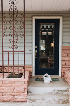 A View of a Food Delivery Bag Left on a Front Porch for a Contactless Delivery