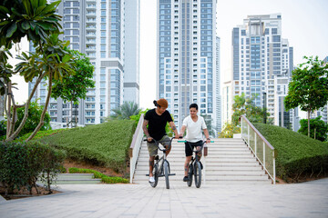 Two young tattooed men having fun on their BMX bikes.