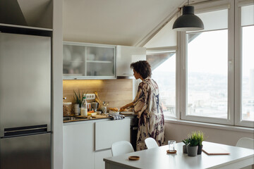 Woman Preparing Breakfast 