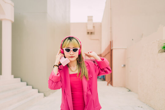 Asian fashion woman with sunglasses and earphones