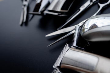 A set of hair cut tools on black background for cutting barber beard salon