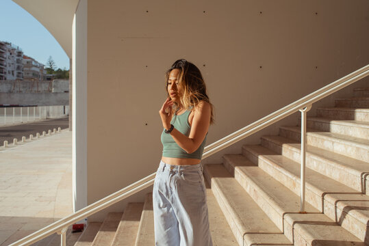 Standing woman looking away portrait