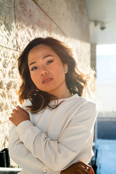 City fashion portrait of a young Asian woman 