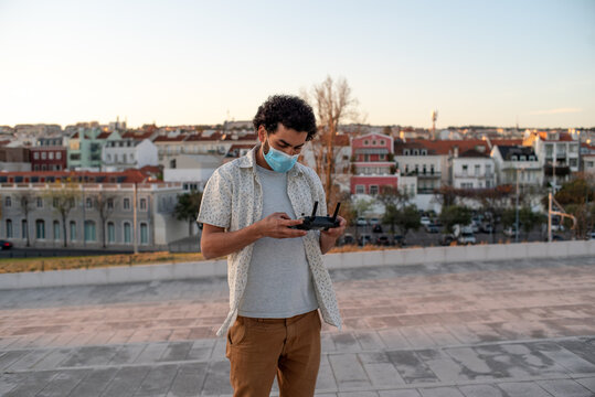 Filmmaker setting the controller for his drone