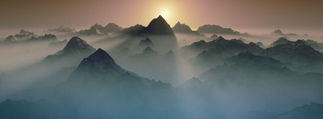 Sun rising over misty mountains