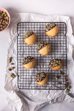 Madeleines with chocolate and pistachio 