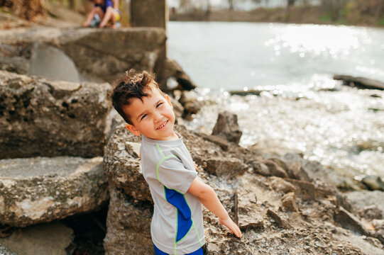Boy with chubby cheeks smiling. 