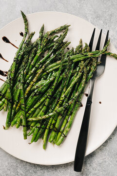 Asparagus spears drizzled with balsamic reduction