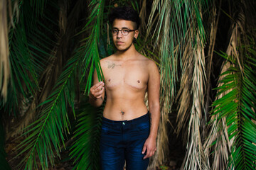 Young transgender man in a park