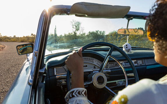 Stylish Woman Driving in Convertible Car 