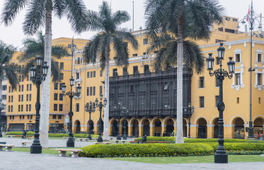 Fototapeta na wymiar Lima main square empty during pandemic times, view of Lima cathedral , Archbishop’s Palace, palms in main square