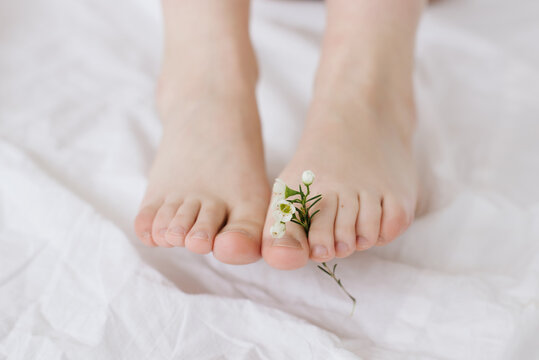 Woman's feet with a flower