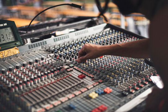 sound engineer controlling Audio Mixer