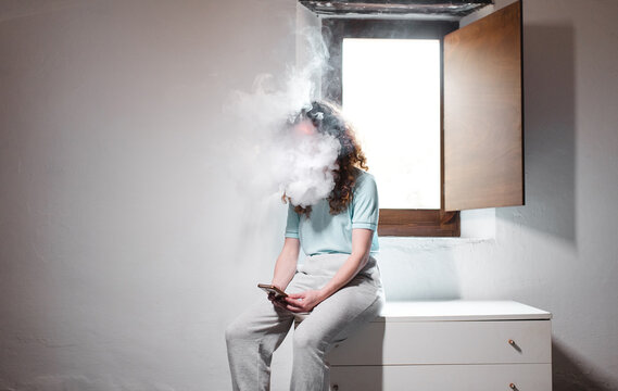 Overwhelmed woman using phone