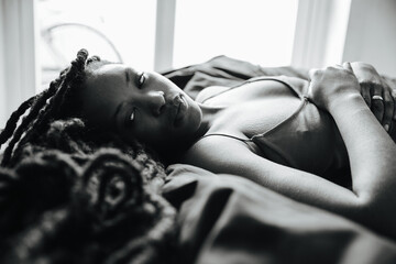 Black girl lying on the bed