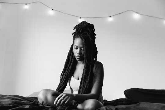 Portrait of pensive young black woman