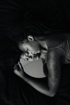 Beautiful black girl reflected in the mirror